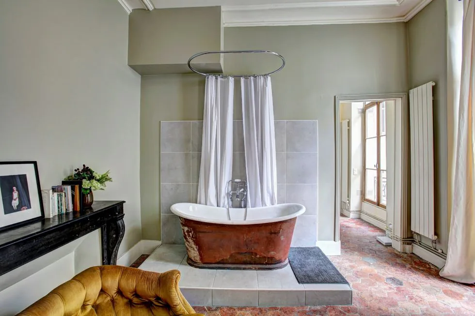 Bathroom with muted green wall finish
